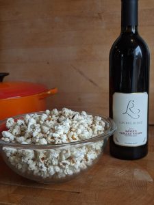 Bowl of popcorn and a bottle of Laurel Ridge David's Tableau Vivant wine